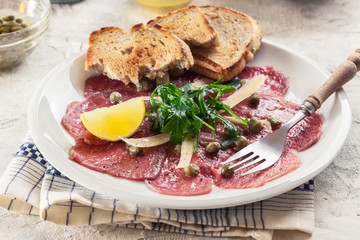 Beef carpaccio with arugula and parmesan