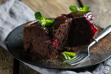 Chocolate brownie with jam and fresh mint