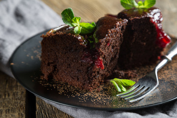 Chocolate brownie with jam and fresh mint