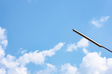 Street lamps with bright blue sky and cloud