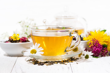 fragrant herbal tea in a cup on white background