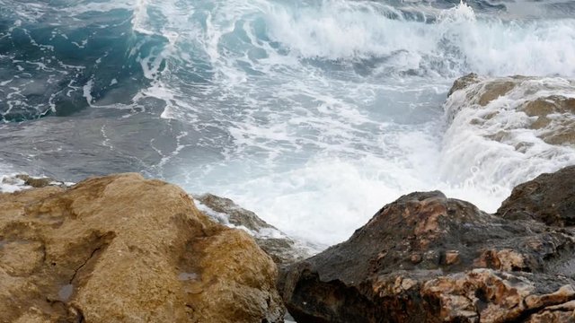 Shot of Saint Paul`s Shoal in Bugibba in Malta, slow motion, waves