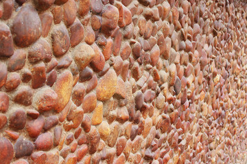 Textura muro de seixos vermelhos