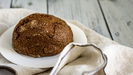Wholegrain low-calorie bread with flaxseeds from wheat, rye and barley seedlings. Healthy bread for a healthy diet