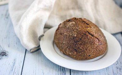 Wholegrain low-calorie bread with flaxseeds from wheat, rye and barley seedlings. Healthy bread for a healthy diet