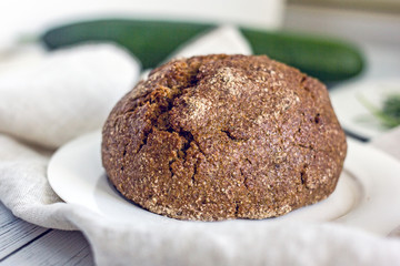 Wholegrain low-calorie bread with flaxseeds from wheat, rye and barley seedlings. Healthy bread for a healthy diet