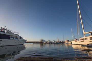 Philippines Mactan Island Yacht club marina on a blue sky day in a tranquil scene with reflections in water