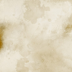 Gold luxury ink and watercolor textures on white paper background. Paint leaks and ombre effects. Hand painted vintage texture.