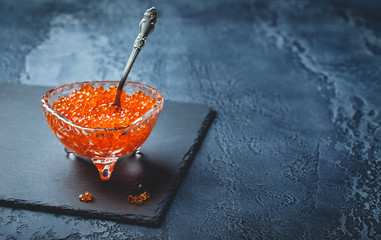 Salmon caviar in glass plate