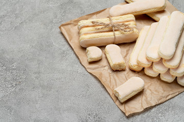 Italian Savoiardi ladyfingers Biscuits on concrete backgound