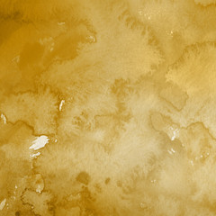 Gold luxury ink and watercolor textures on white paper background. Paint leaks and ombre effects. Hand painted vintage texture.