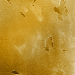 Gold luxury ink and watercolor textures on white paper background. Paint leaks and ombre effects. Hand painted vintage texture.