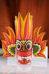 Sri Lanka national fire mask decorated in bright red and yellow colors.