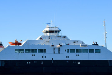 A fragment of the ferry against the blue sky. Sea transport.