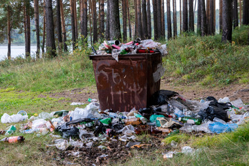 Recycle bin and garbage on ground landscape