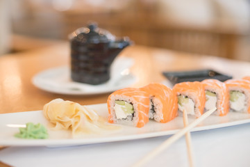 Philadelphia roll sushi with salmon, smoked eel, cucumber, avocado, cream cheese, red caviar. Sushi menu. Japanese food.Japanese sushi as healthy lunch.Philadelphia Maki Sushi made of Fresh Raw fish