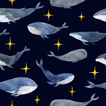 Seamless pattern of watercolor calm whales in gray and blue tones, and with shine yellow sparkles