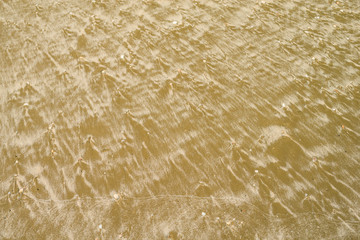 Patterns of sand by the sea.10