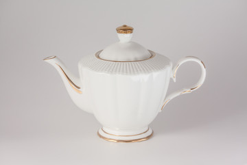 Beautiful white porcelain teapot on white background.