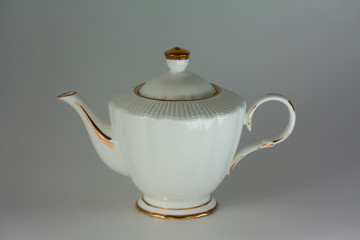 Beautiful white porcelain teapot on white background.