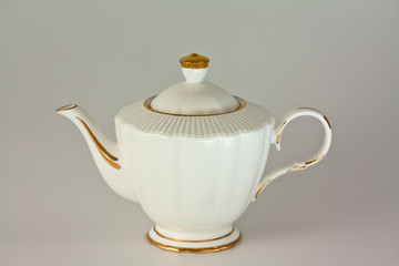 Beautiful white porcelain teapot on white background.