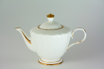 Beautiful white porcelain teapot on white background.