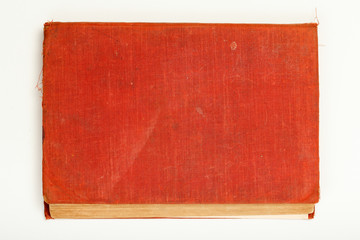 Red old hardback book on white background.