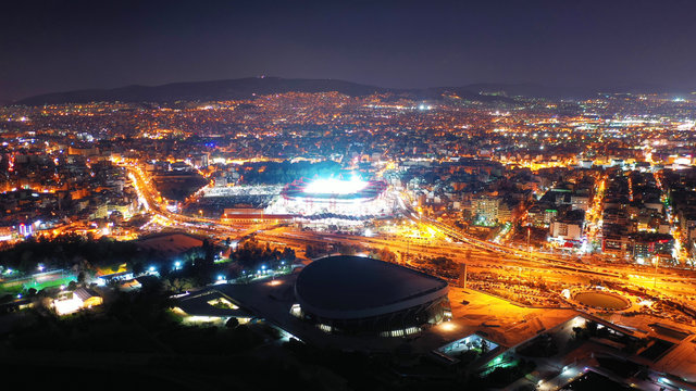 Aerial drone photo of famous illuminated football stadium of Karaiskaki in the heart of Piraeus, Attica, Greece