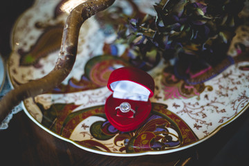 Beautiful wedding ring in packing in the form of a of red heart