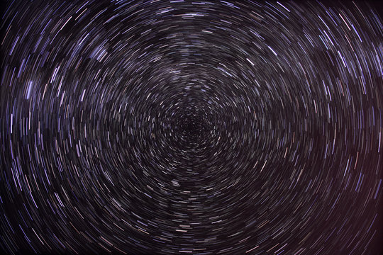 Dark sky with circumpolar star trails