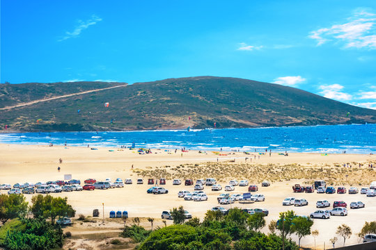 Parking lot full of cars of kitesurfers parked on Prasonisi beach (Rhodes, Greece)