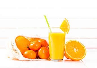 Fresh juice, Orange drink with fruits on wooden table. 
