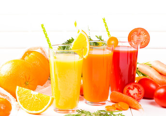Fresh juices, Orange, Carrot, Apple, Tomato drinks with fruits and vegetables on wooden table. 