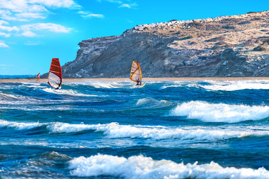 Two windsurfers surfing on Prasonisi beach (Rhodes, Greece)