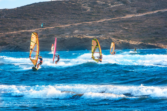 Windsurfers and kitesurfers ride on Prasonisi beach (Rhodes, Greece)