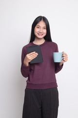 Young Asian woman with a computer tablet and coffee.