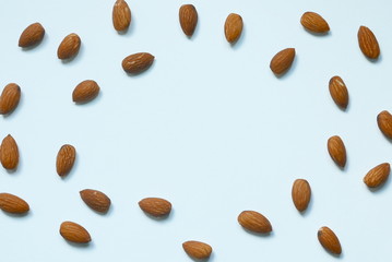Top view of almonds nut on white background. Copy space for text or logo.