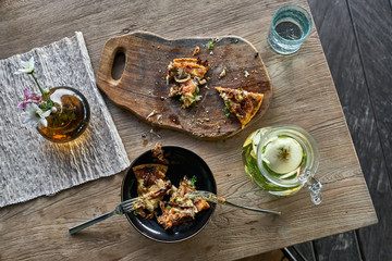 Healthy dinner with vegetarian pizza and lemonade drink