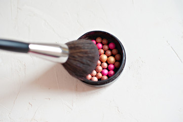Blush, Blush brush. Kit pink makeup on white background, soft and selective focus, the concept of beauty