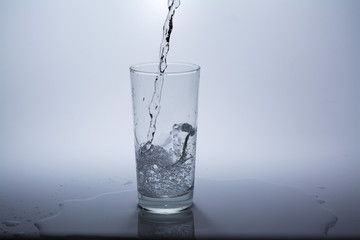 Pure water is poured into a glass
