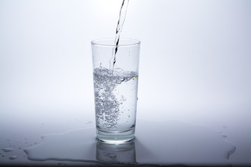 Pure water is poured into a glass