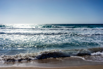 Fototapeta na wymiar Waves on the beach of Falasarne, Greece, Crete