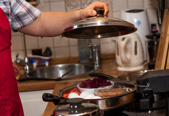 cooking vegetables and steamed eggs in a saucepan