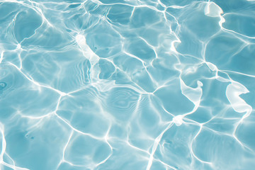Texture of water in swimming pool for background