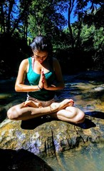 woman meditating in lotus pose