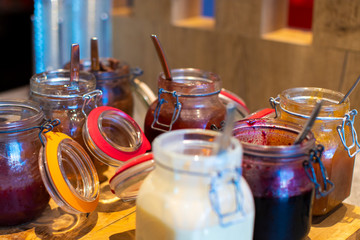 Set of various jams at hotel breakfast