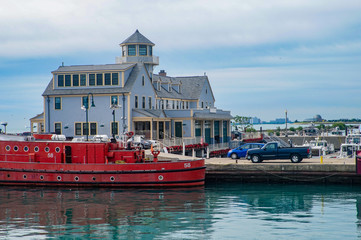  View of a traditional house and a red boat in the pier of Michigan Lake, Chicago, Illinois