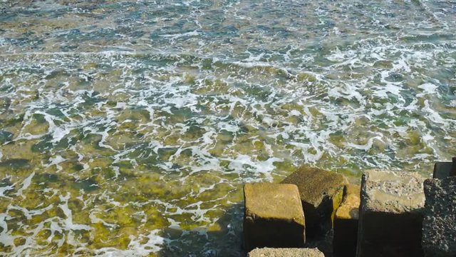 waves rushing into the blocks near INS khukri memorial in Diu gujarat india