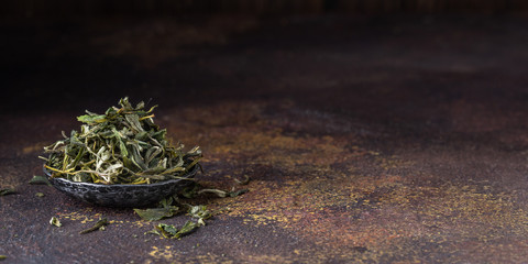 Dry white Loose Leaf Tea in a Bowl/ Copy space.