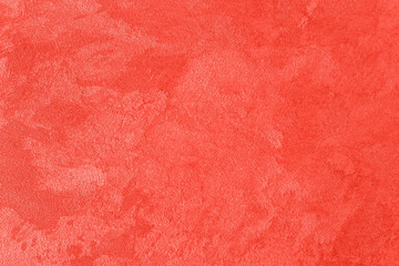 Textur von lebendem korallenrotem Zierputz. © Eugene_Photo